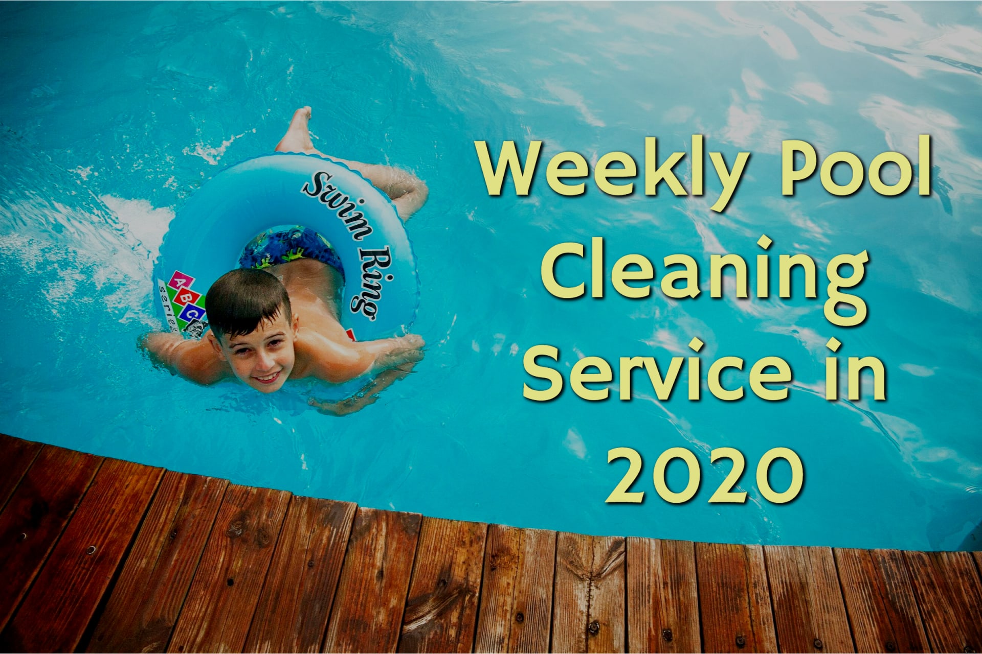 Boy swimming in a clean pool from weekly pool cleaning service